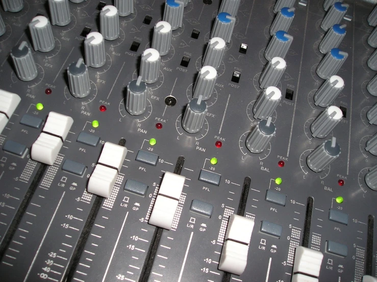 controls for the mixing board in a recording studio