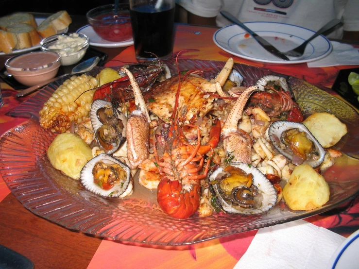 a plate that has many different types of seafood on it