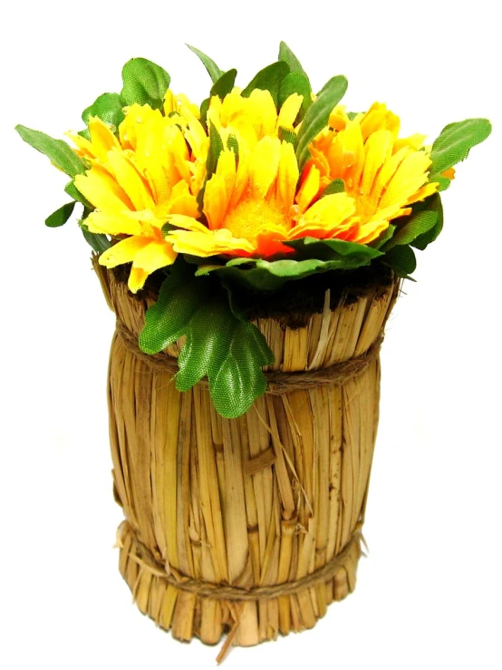 a basket filled with yellow flowers next to leaves