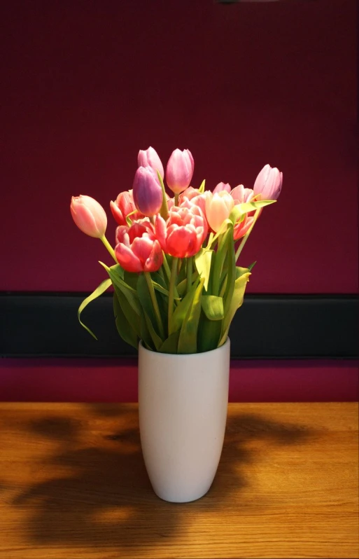 a close up of a vase with flowers in it