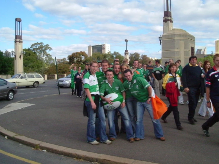 group of people on the street outside of a church