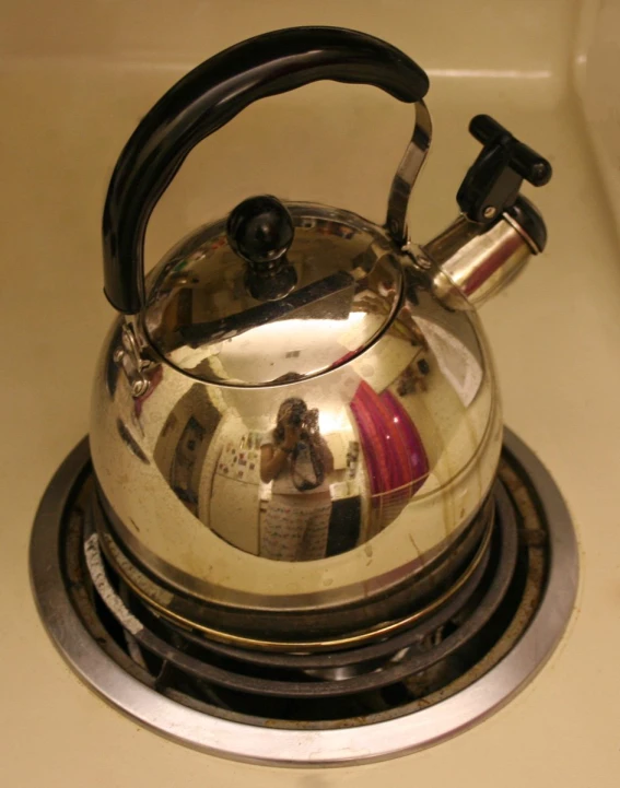 a close up view of a kettle on the stove