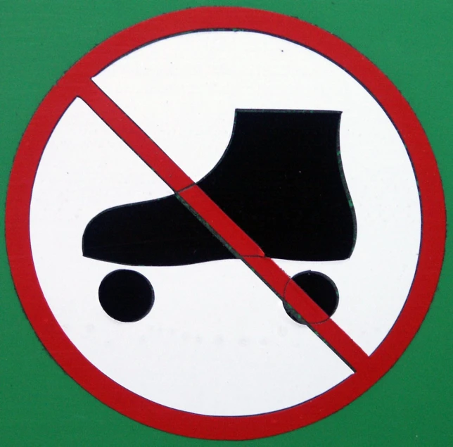 the sign says no roller blades