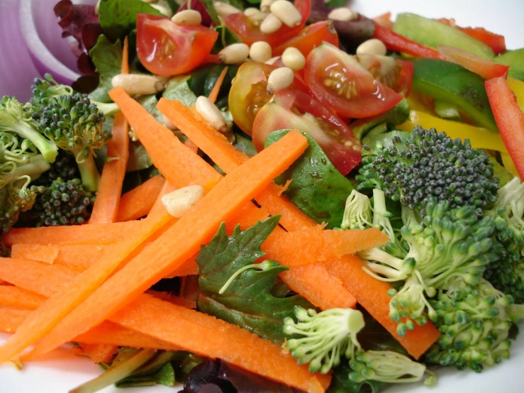 a plate full of assorted vegetables including broccoli