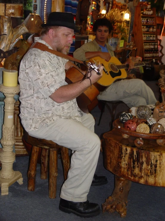 a man holding an instrument while playing it