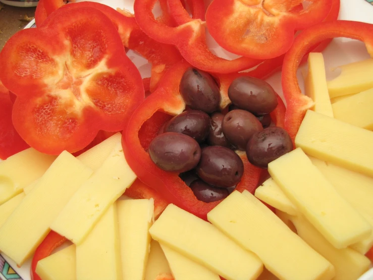 fresh fruit and cheese are laid on top of each other