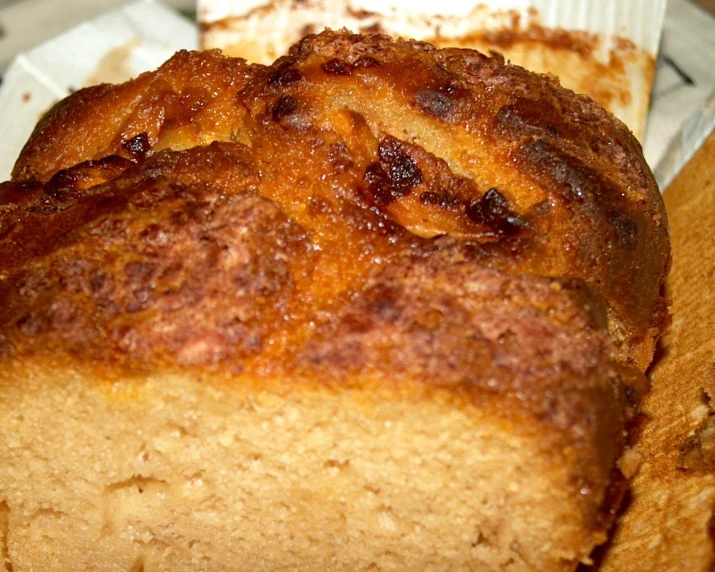 a cake sitting on top of a  board next to a container