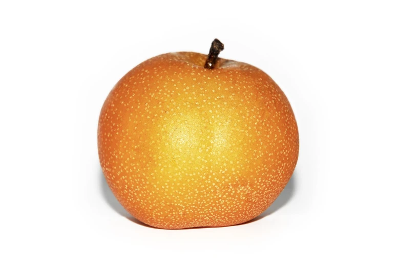 an orange sitting next to a white background