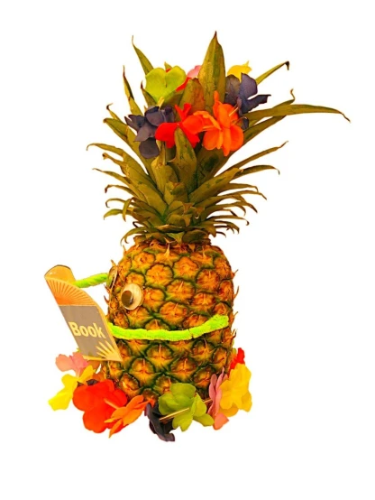 a pineapple decorated with flowers, and a sign saying root