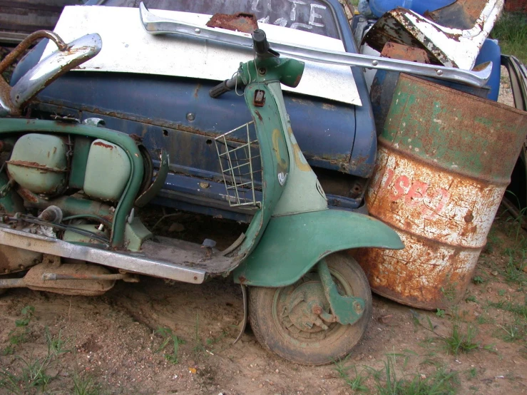 the old scooter is rusting and needs to be restored