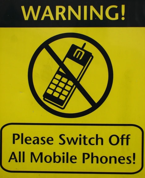 a sign describing who is responsible to operate a telephone