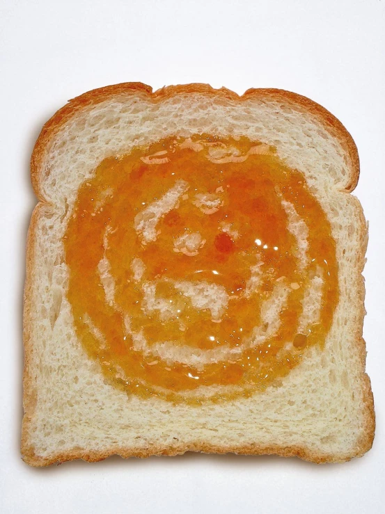 two slices of bread are topped with jelly