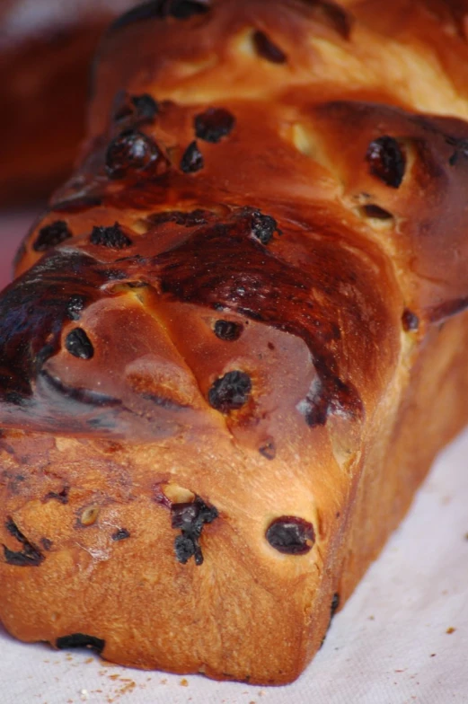 baked bread with raisins and jam on a sheet