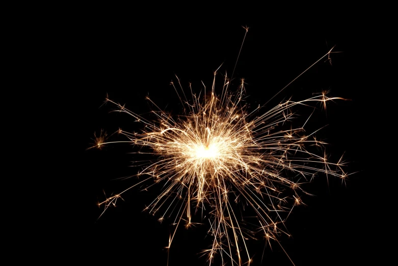 a fireworks show with lots of sparks in the dark sky