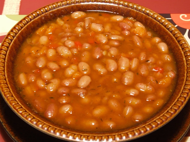the bowl of soup contains beans in it