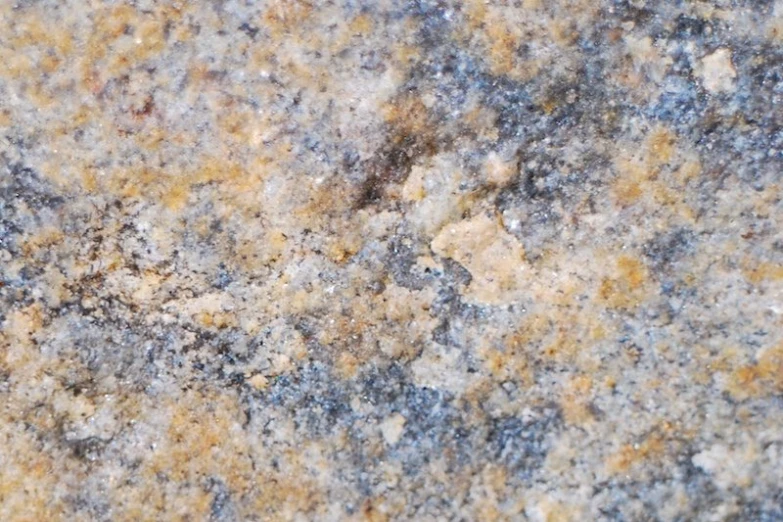 grey marble textured with yellow and black dots