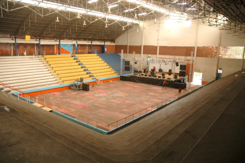 inside view of an auditorium with many empty seats