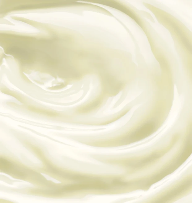 some white colored milk is close up with a blurry background