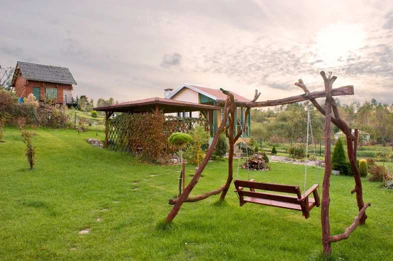 a park bench sitting on top of green grass