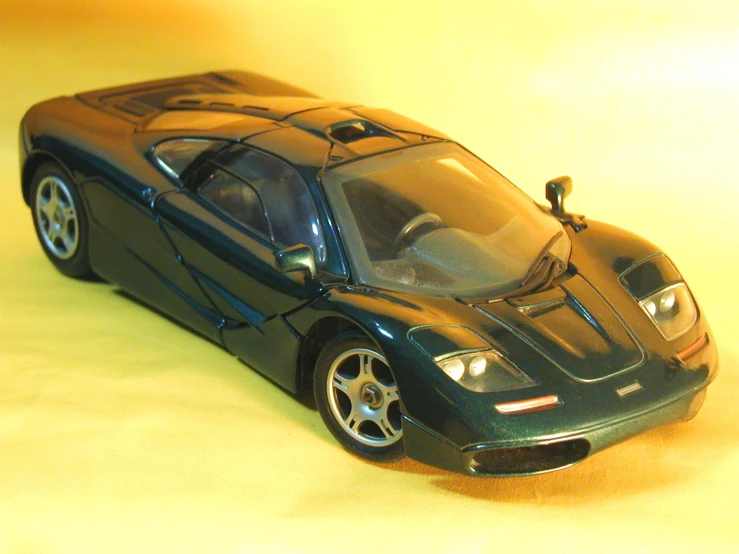 a model of a sports car sitting on the ground