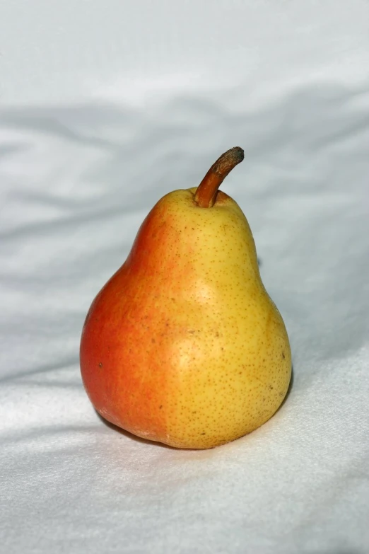the yellow and red pear is in focus