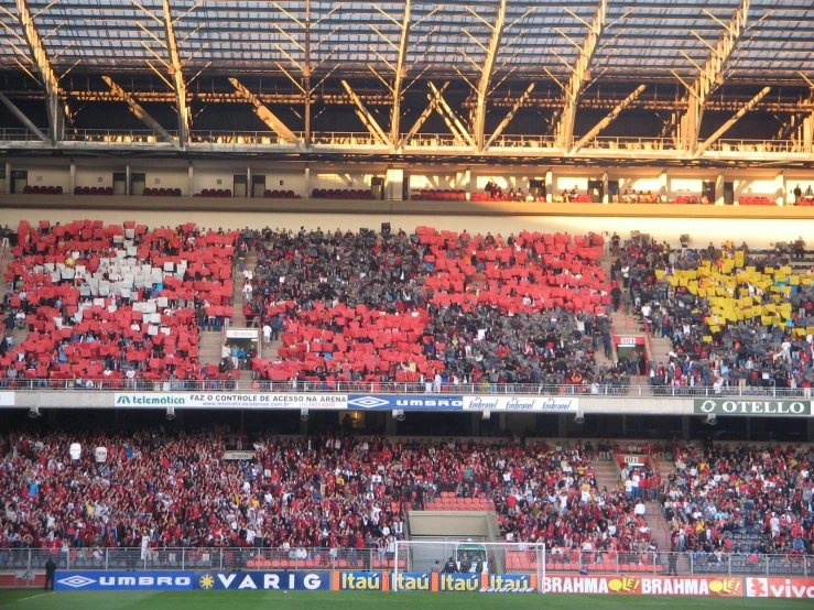 a stadium full of people with red jackets