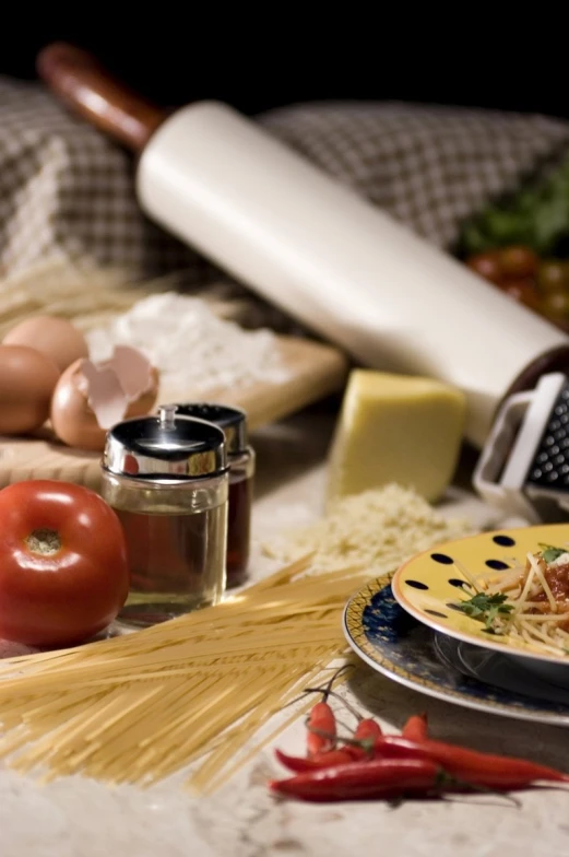 a plate of pasta with several ingredients on the table