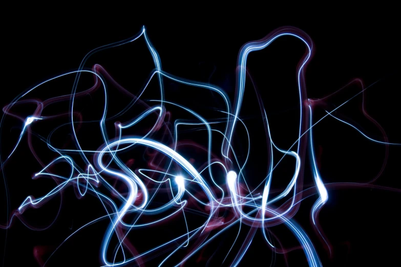 a blue, red and white light streaks on black