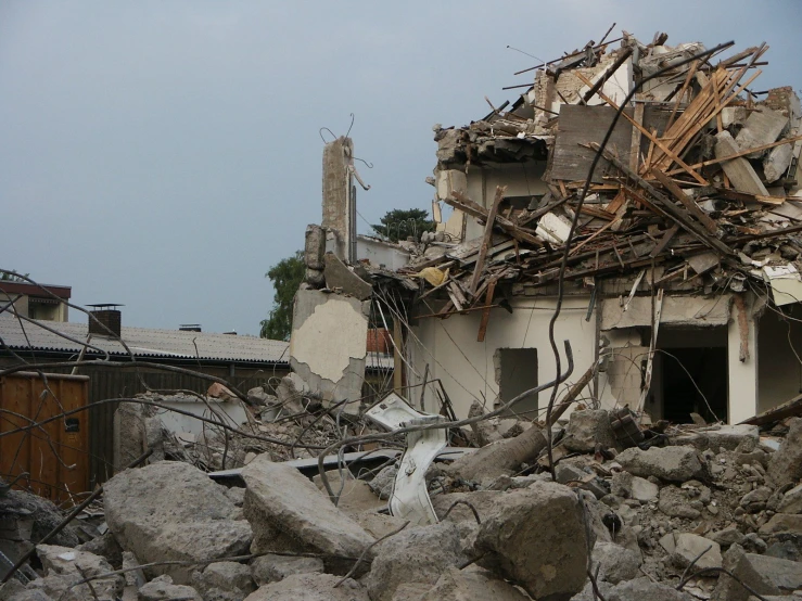a building that is very destroyed and has rubble surrounding it