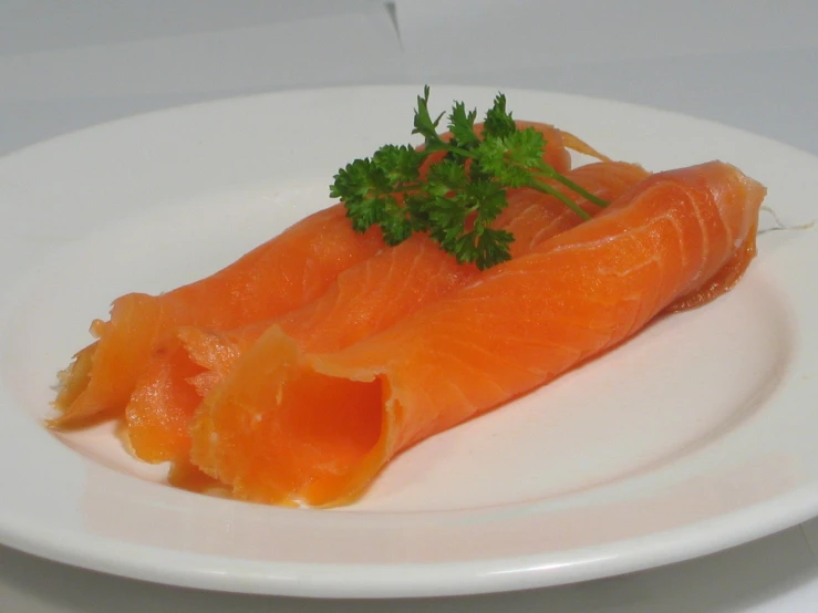 some salmon on a plate with parsley