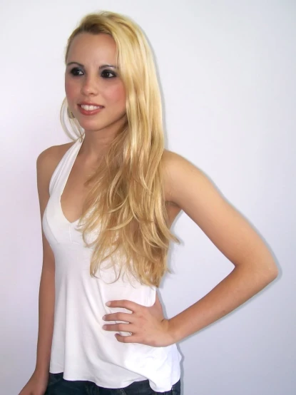 a beautiful young blonde woman wearing white shirt