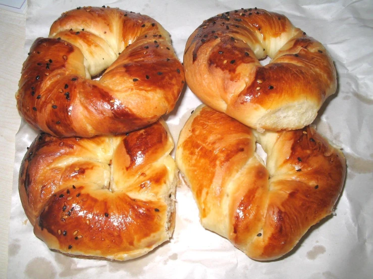 six pull apart breads sitting on top of a piece of white paper