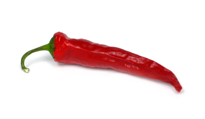 an orange bell pepper with a white background