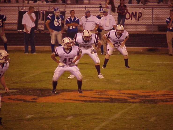 a football player is on the field preparing to kick a ball