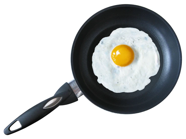 an egg frying in a set on a white background