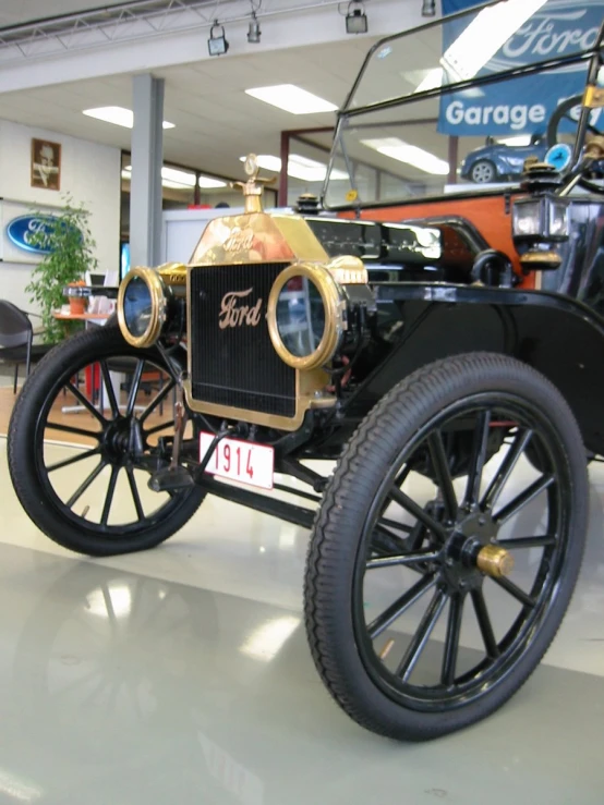 antique ford model t automobile displayed in showroom