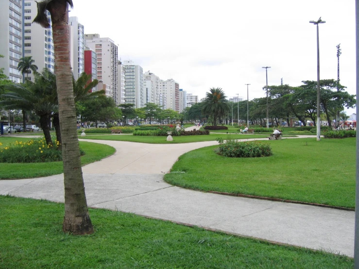 a pathway between two streets leads to a park