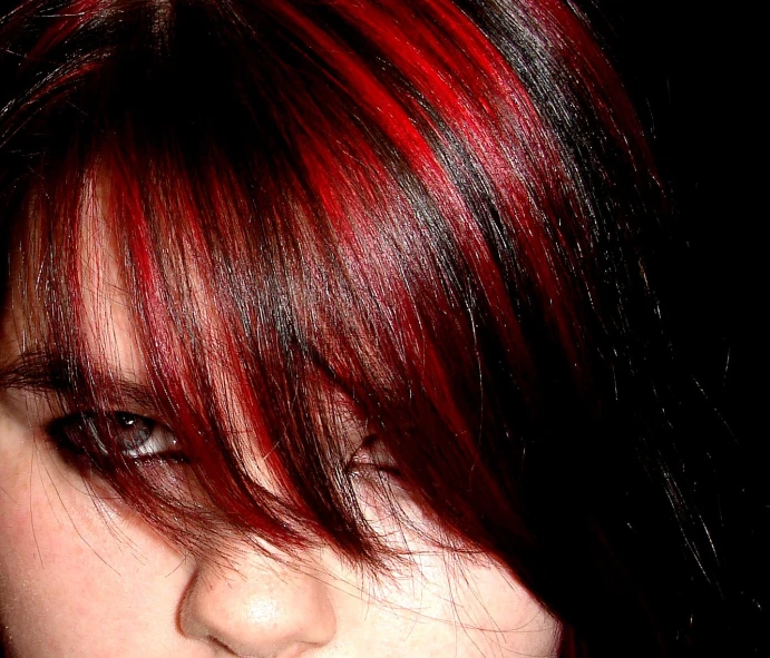 the face and hair of a person with bright red hair