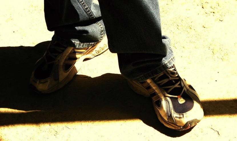 the foot of an unpreved person wearing sneakers