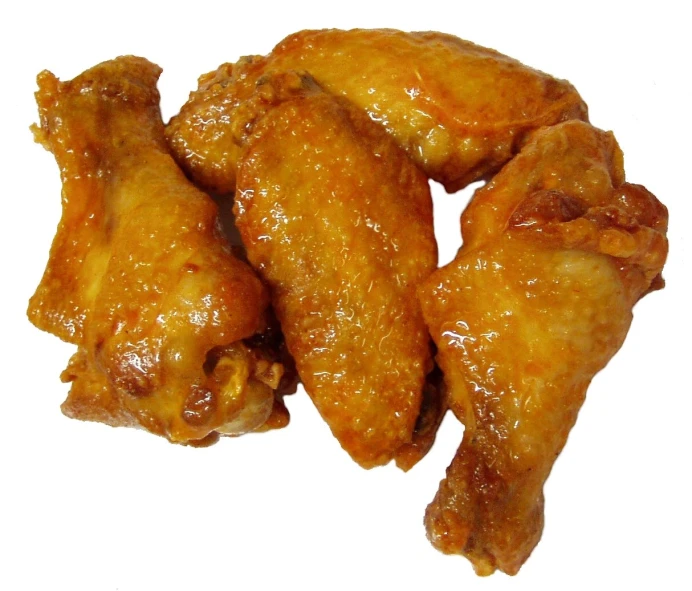 pieces of chicken wings on a white surface