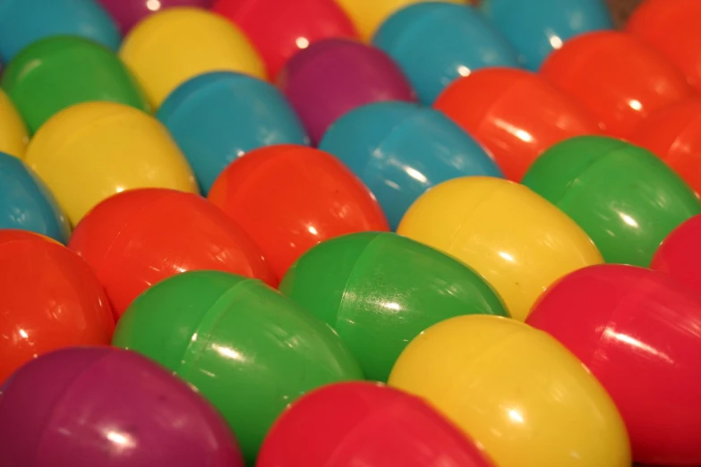 colorful balls are scattered together in a row