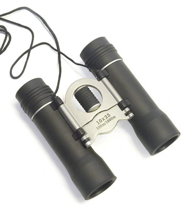 the binoculars are attached to the shoulder strap