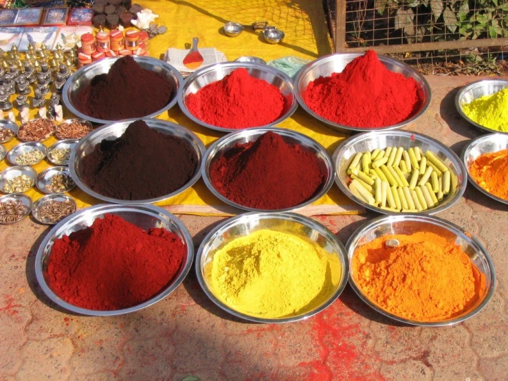 a group of bowls of spices and spices