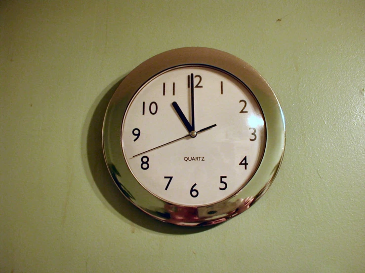 a large metal clock is on the wall