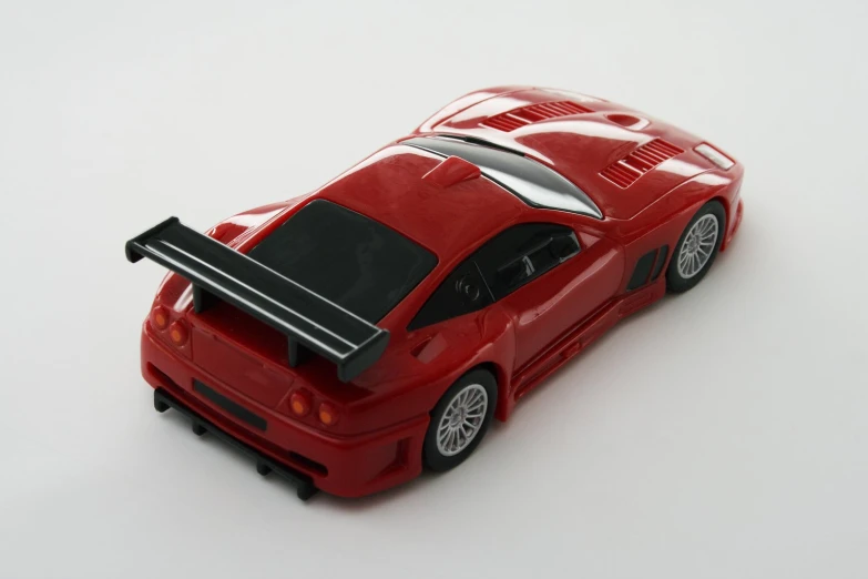a toy car on a white background with a white background