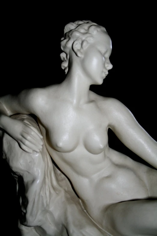 a white statue with an intricately made body