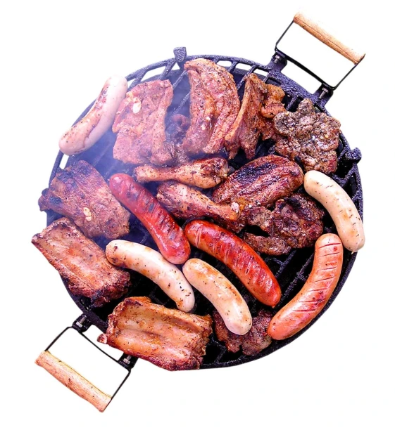 many sausages and  dogs are cooked on the grill