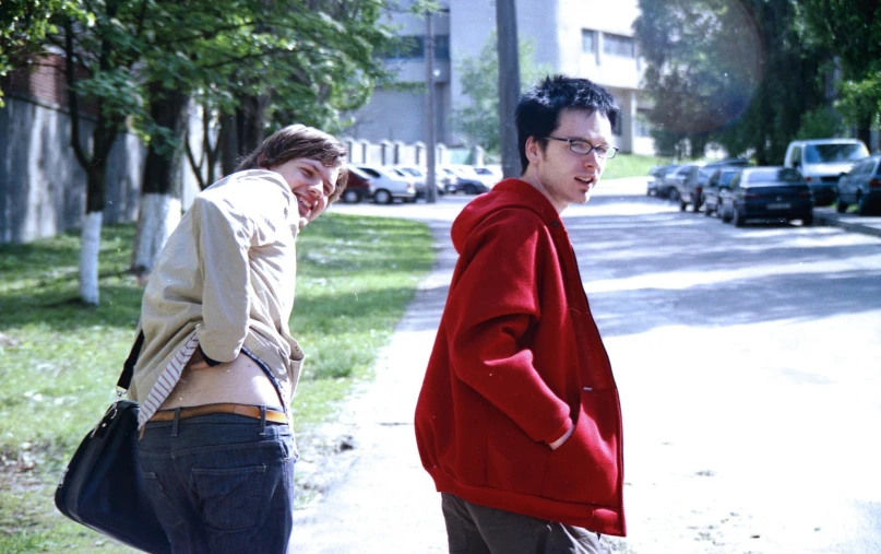 a man and woman in red jackets walking together