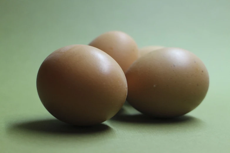 three eggs laying on top of each other