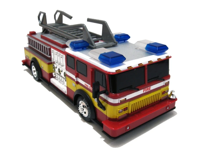 a toy fire truck sitting on top of a white background
